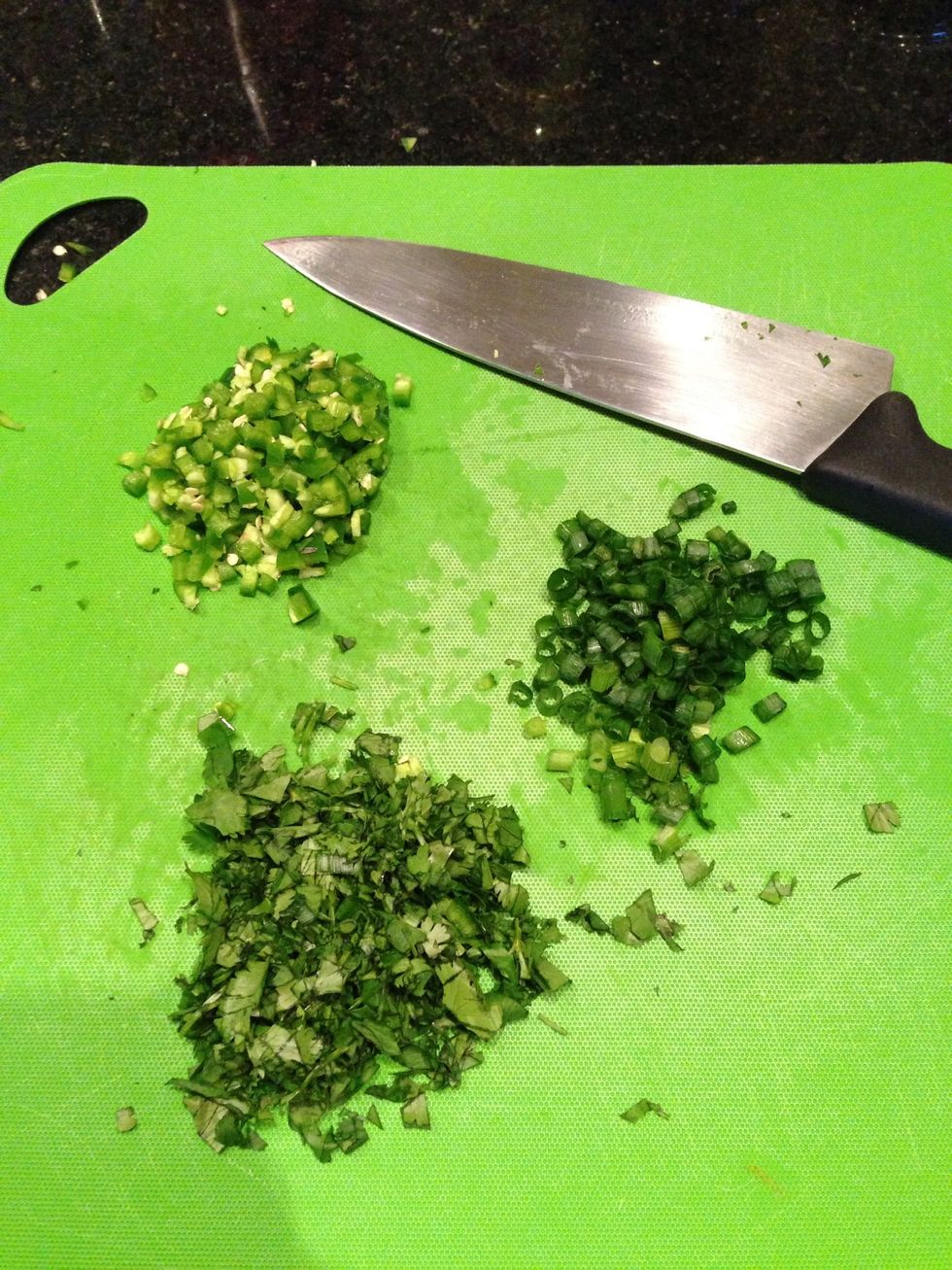 Chop the green onions, cilantro, and jalape\u00f1os and stir them into the tomatoes.
