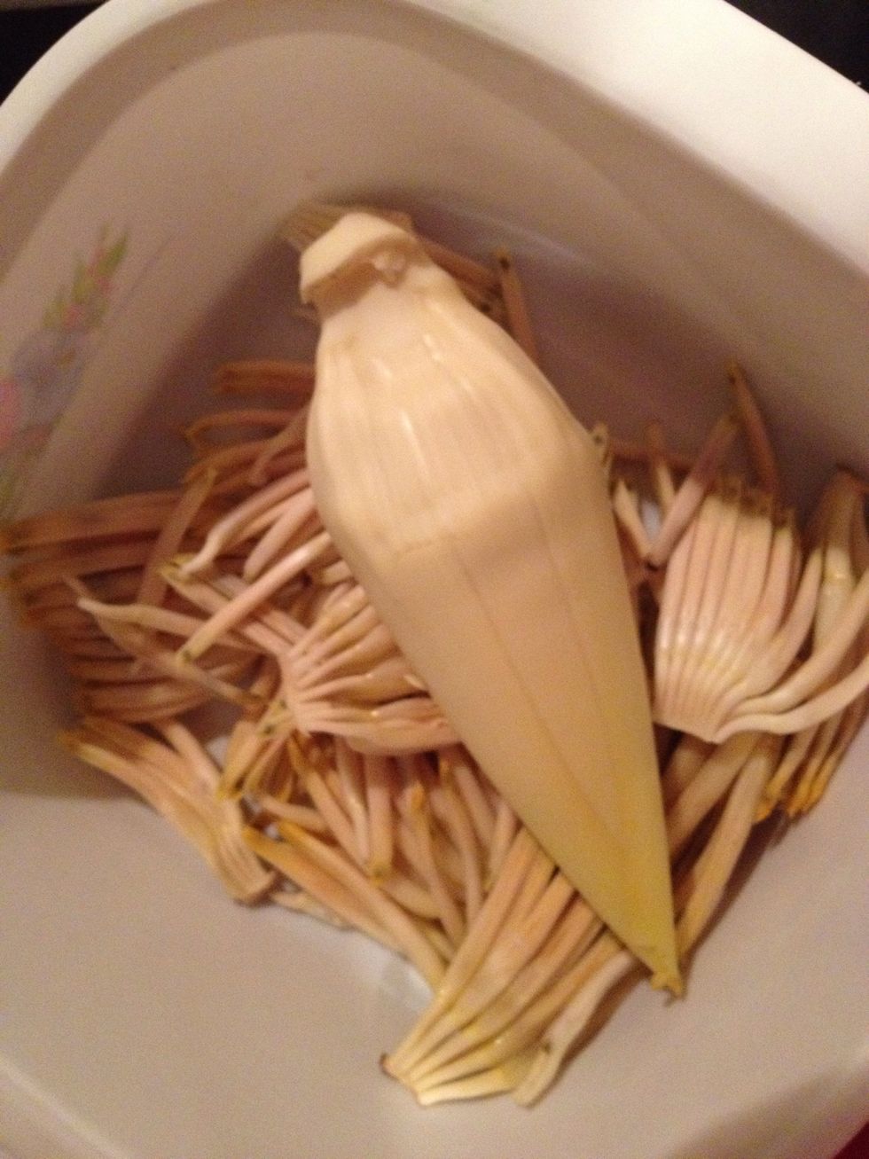 Chop the heart small too, work quickly as it's very starchy and it discolours quickly.  Apparently you can find canned banana blossom hearts too, they are similar to artichoke hearts in taste.