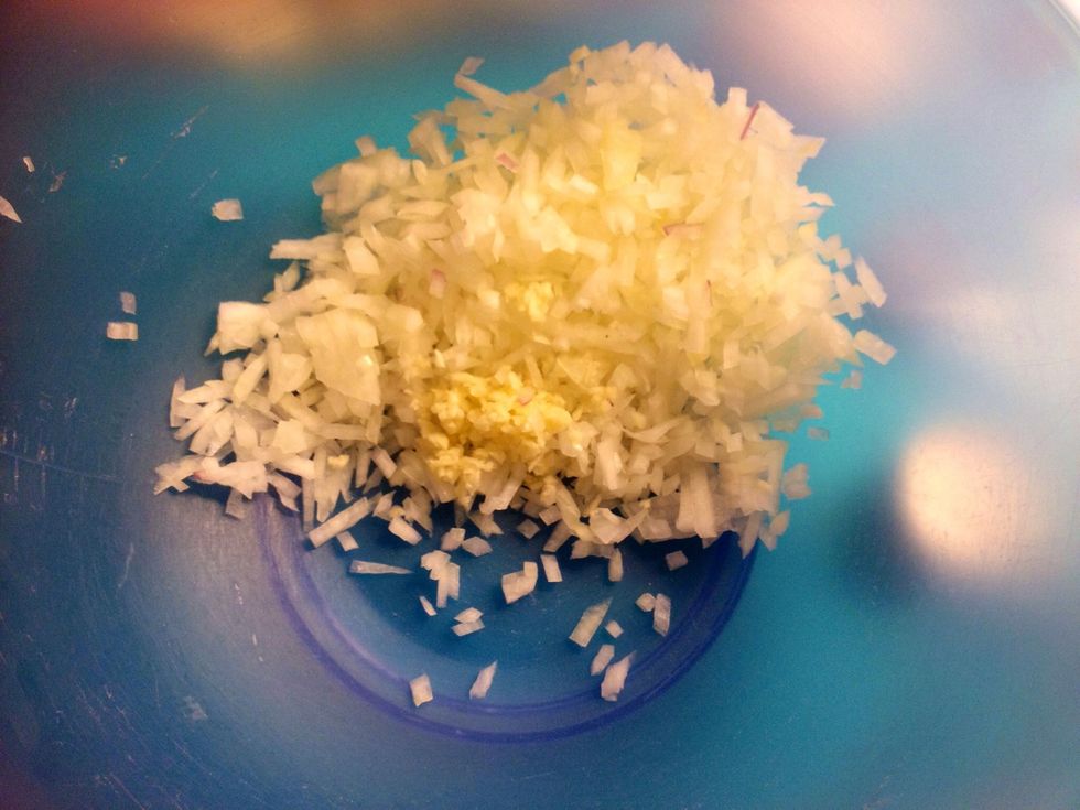 Chop the onion and the garlic.
