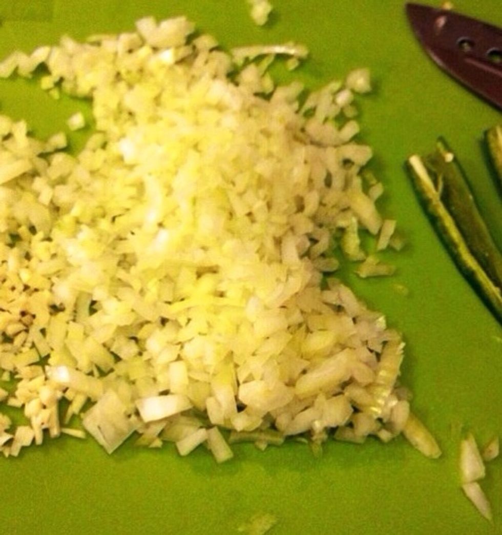Chop the onion, garlic and green chili.