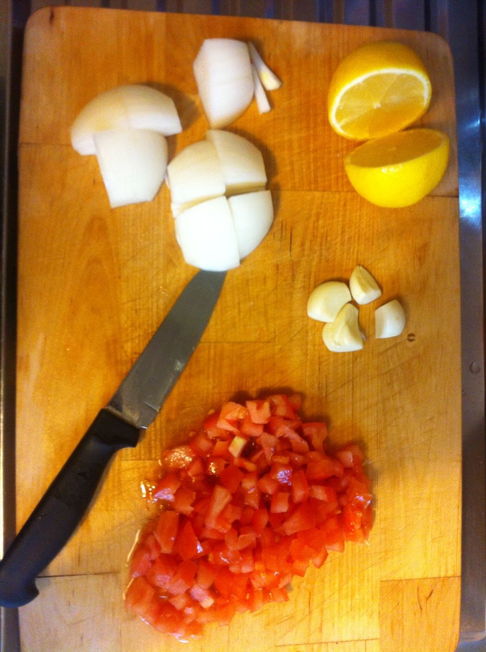 Chop the onion, garlic, and the tomato
