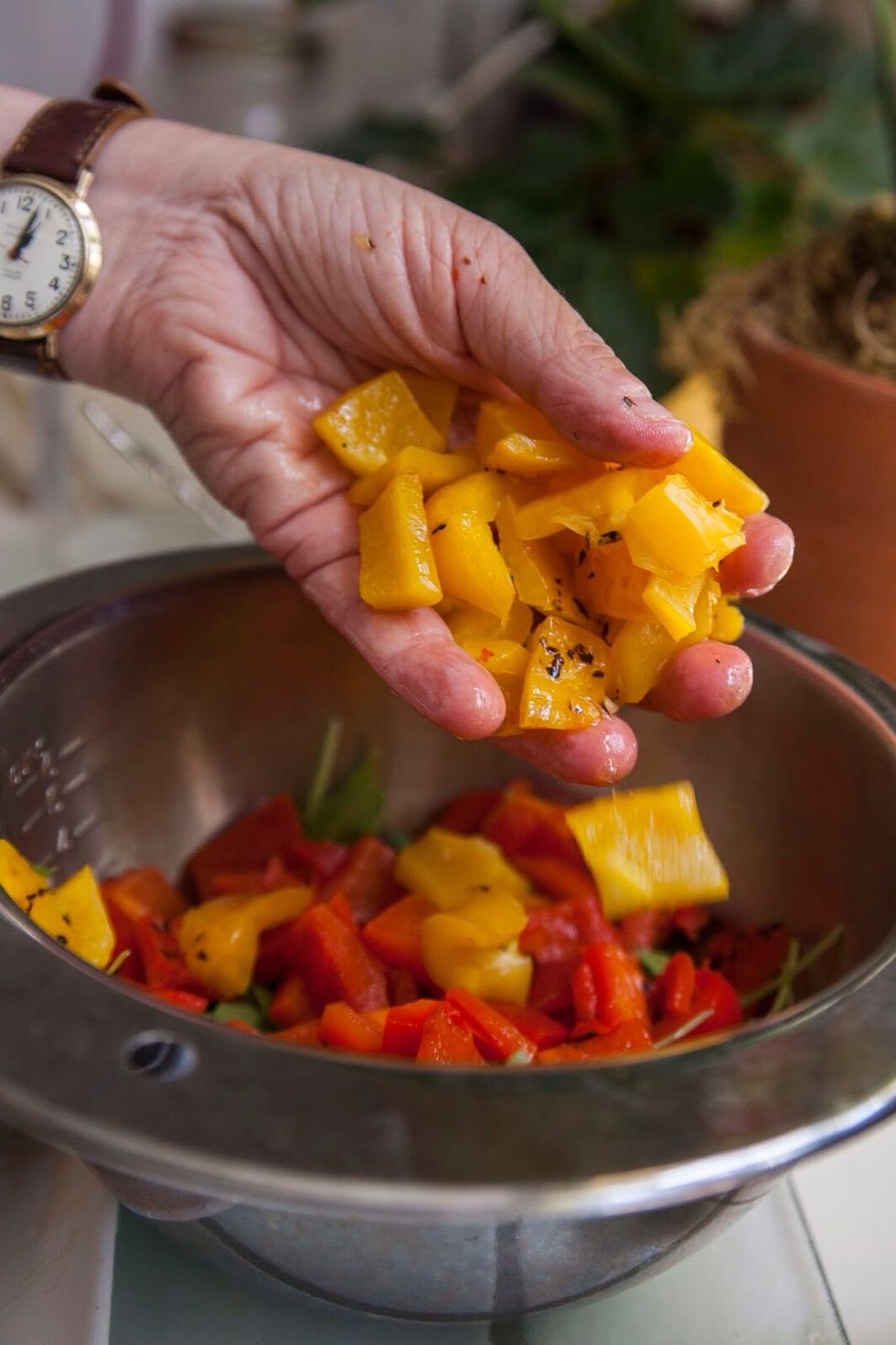 Chop the pepper into strips and then squares. Add the arugula on top of the roasted peppers.