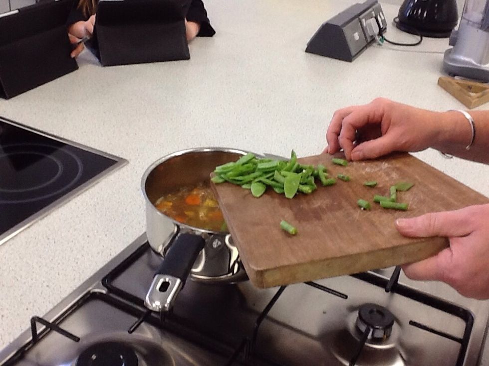 chop the runner beans and put them in the souce pan