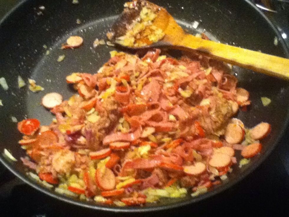 Chop the sausages, beef,onion, and put them in a pan and saut\u00e9 until brown