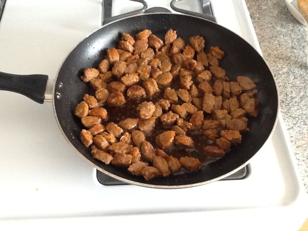 Chop the sausages (it's easier to chop them while they're still a little frozen) and brown them in a saute pan on medium high heat.