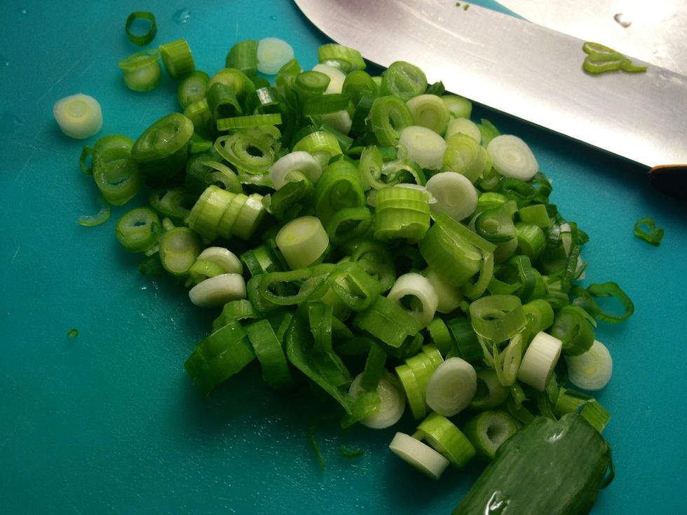 Chop the spring onions. I like to use both the green and the white parts but that's up to you.