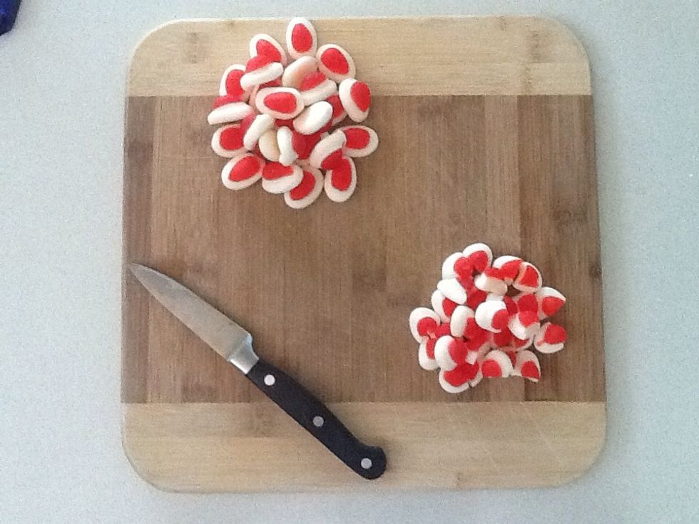 Chop the strawberries and cream in half