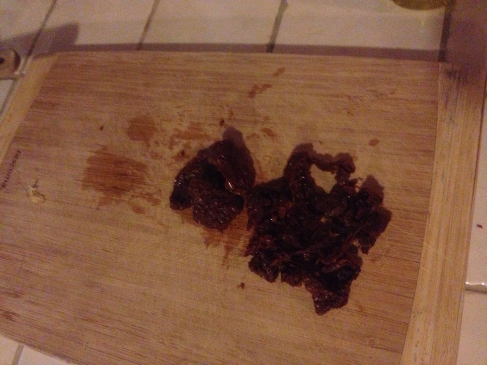 Chop the sun dried tomatoes and add to the pan with onions and garlic