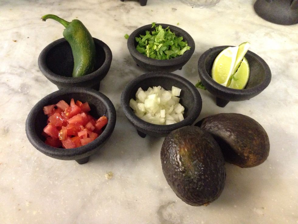 Chop the tomato, onion, jalape\u00f1o and cilantro