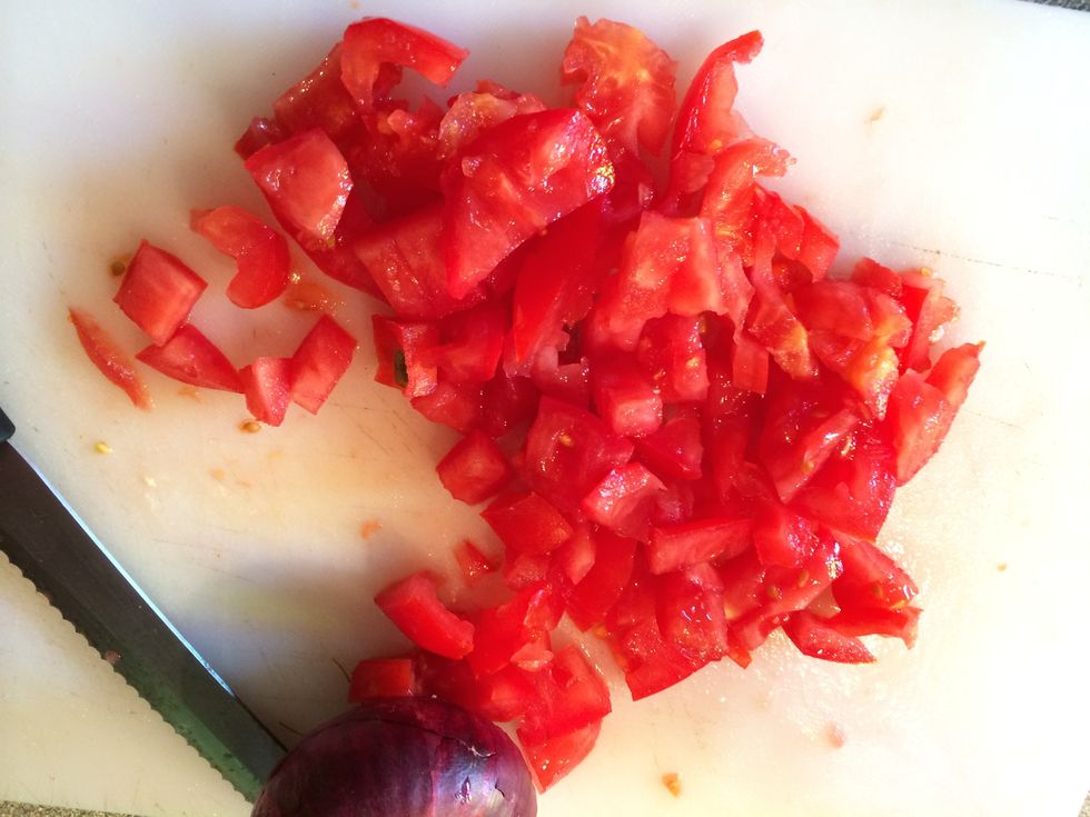Chop the tomatoes into chunks.