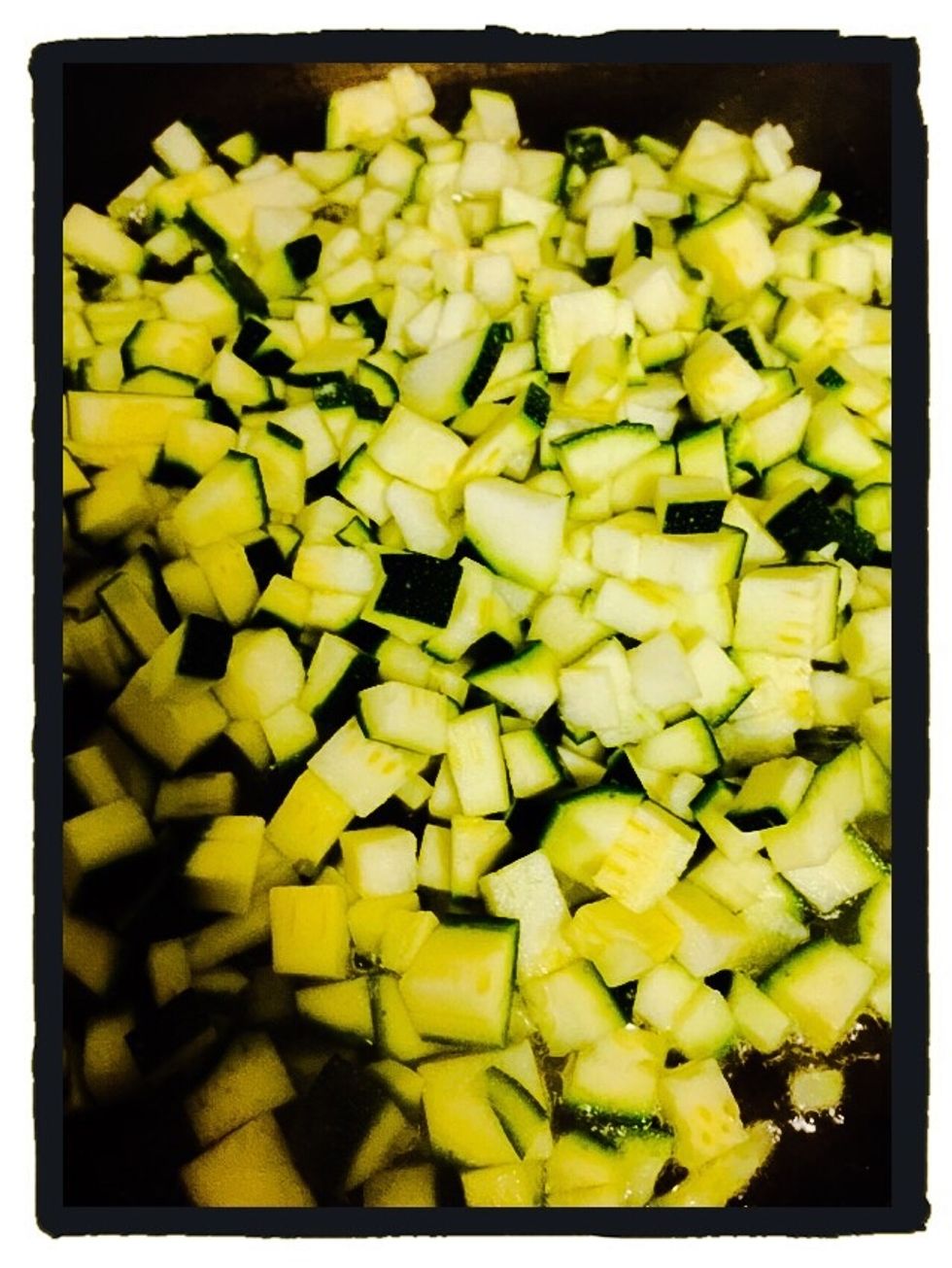 Chop the zucchini and fry it in 1 tbsp olive oil