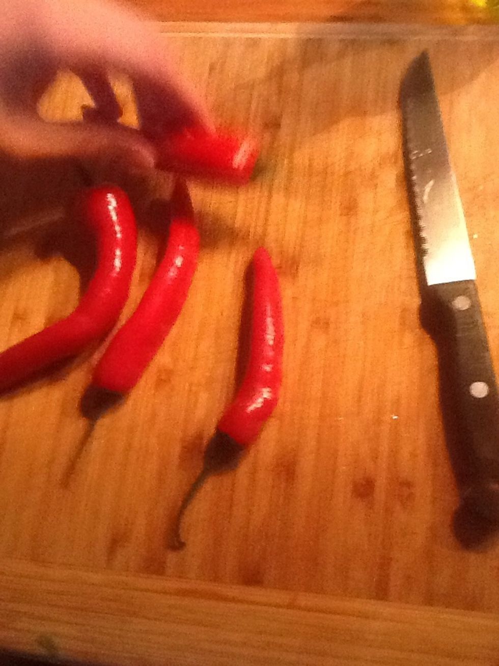 Chop two-three chillies into similar sized pieces, deseed them if you don't want then too hot.