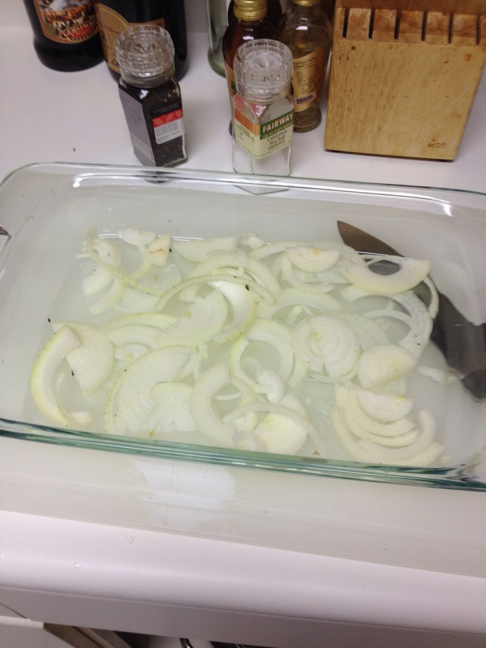 Chop up 1 onion to an oven tray