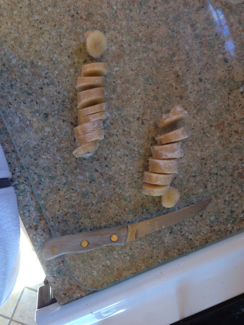 chop up a banana. mine was frozen because I like my smoothie thick & icy, but that's completely optional. if you prefer it icier but don't have frozen bananas at hand, just add 1 or 2 more ice cubes.