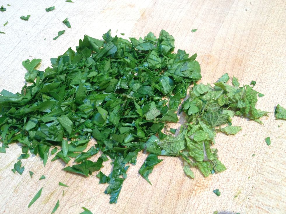 Chop up a bunch of parsley and mint.