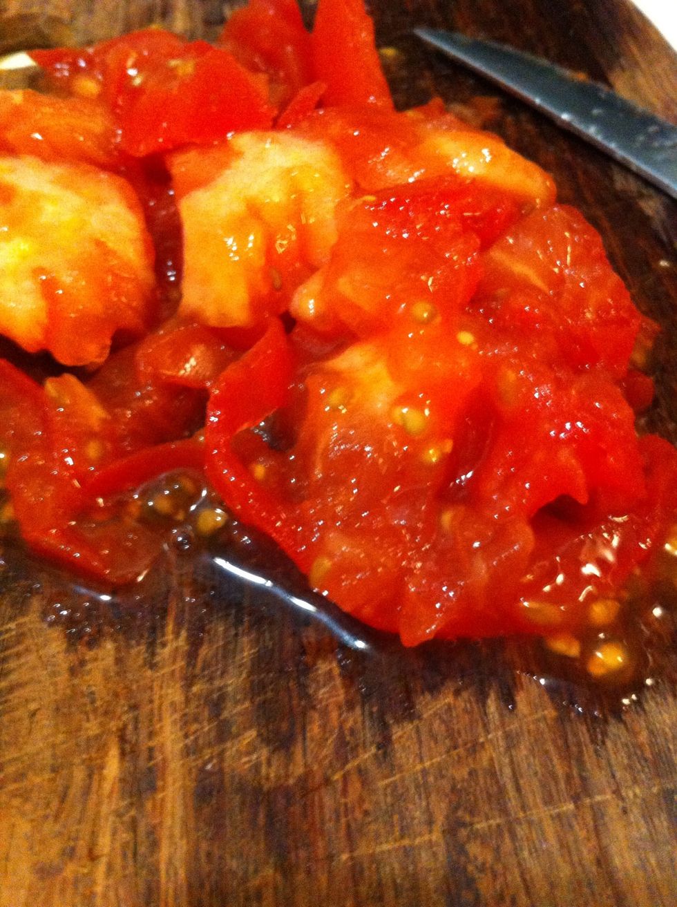 Chop up a ripe tomato and add to pan; mash up as it cooks adding oregano, salt, pepper to taste
