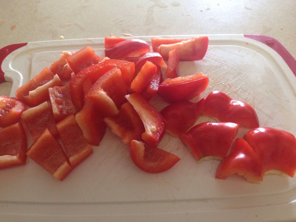 Chop up a whole red pepper insides removed.