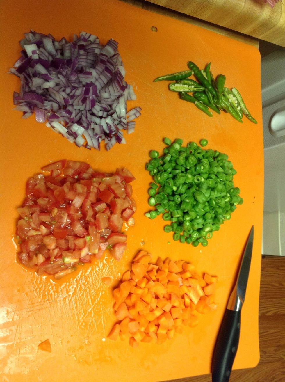 Chop up all the onions, tomatoes, green chillies and any other veggies you prefer. I used carrots and green beans. Peas would be a great addition too.