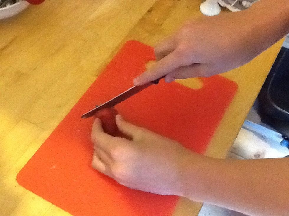 Chop up most of the strawberries into quarters