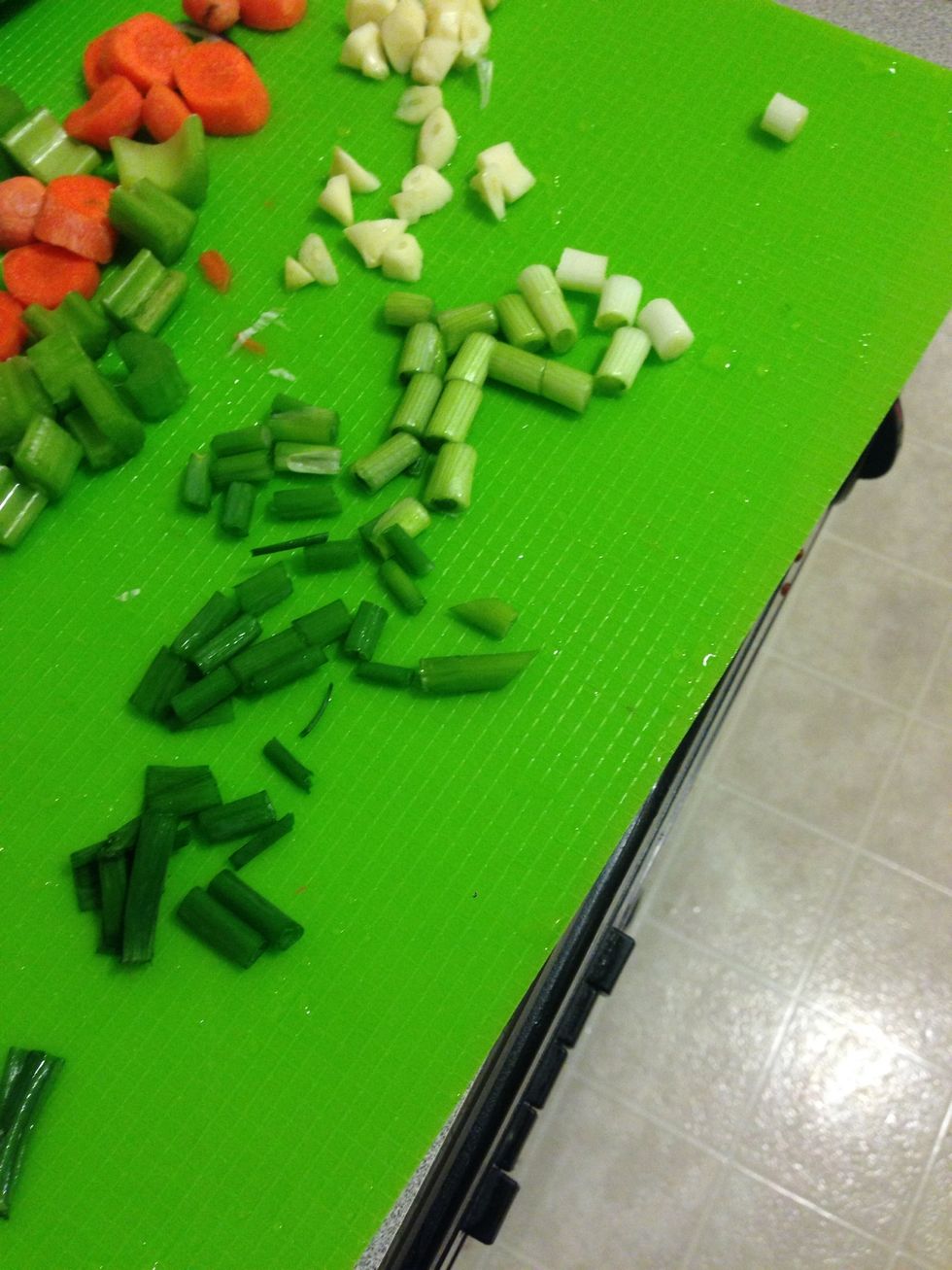 Chop up the 2 green onions and 3 celery stalks.
