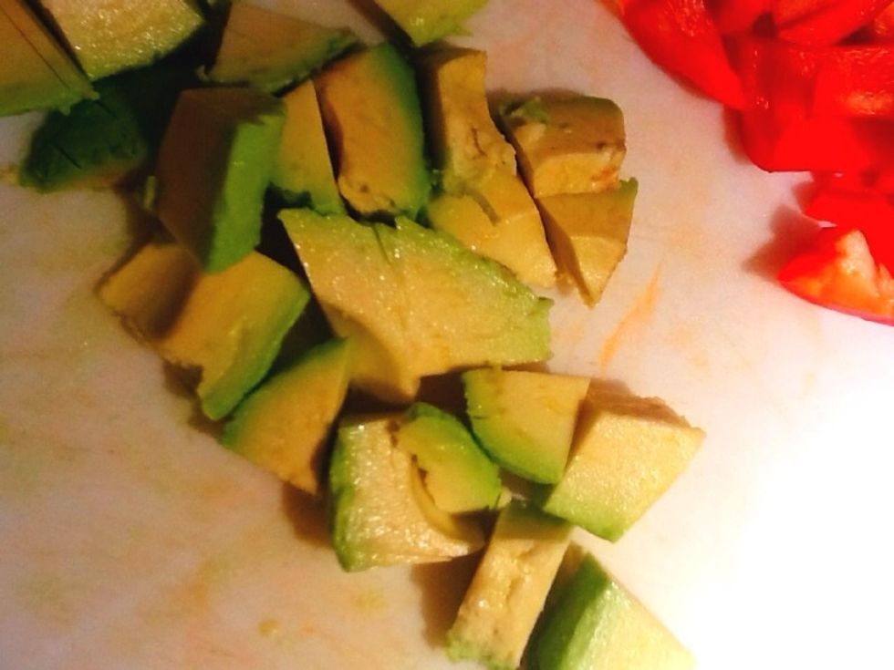 Chop up the avocado into 1/2 inch chunks. If you can't get the avocado out of its skin, after cutting it in half, a spoon stuck between the fruit and skin at the widest end will help slide it out!