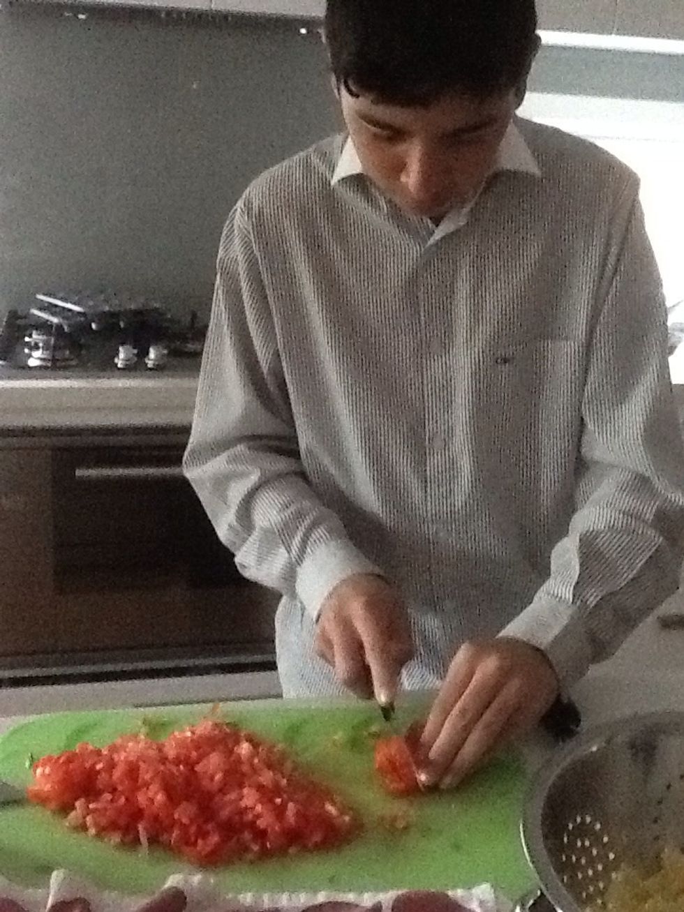 Chop up the four ripe tomatoes into small pieces.