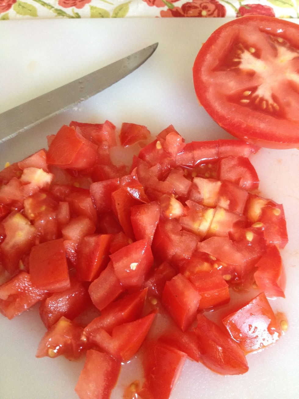 Chop up the tomato. You can also use cherry tomatoes and just cut those in half. Use different colored tomatoes for an even more colorful salad.