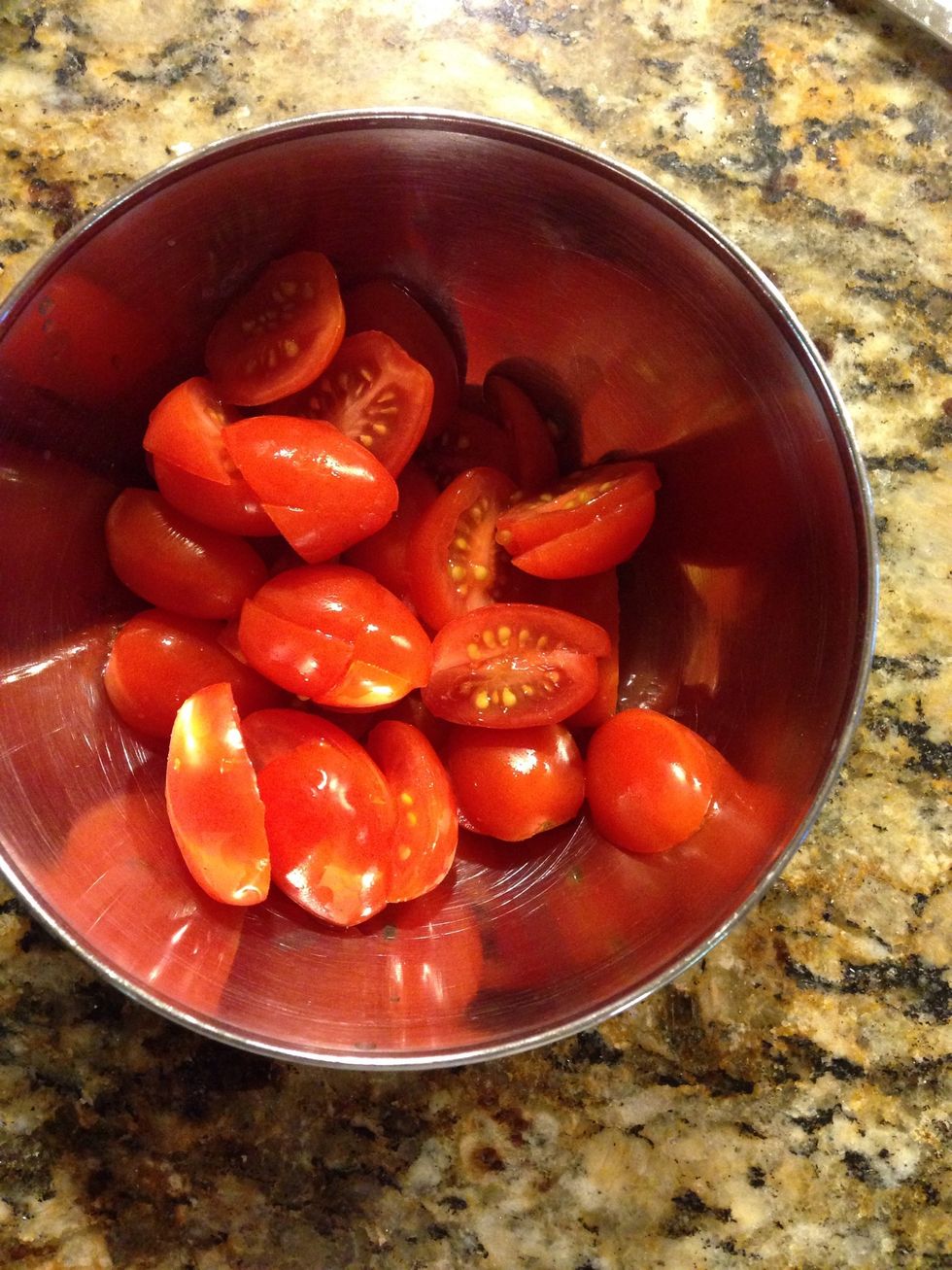 Chop up tomatoes in a bowl