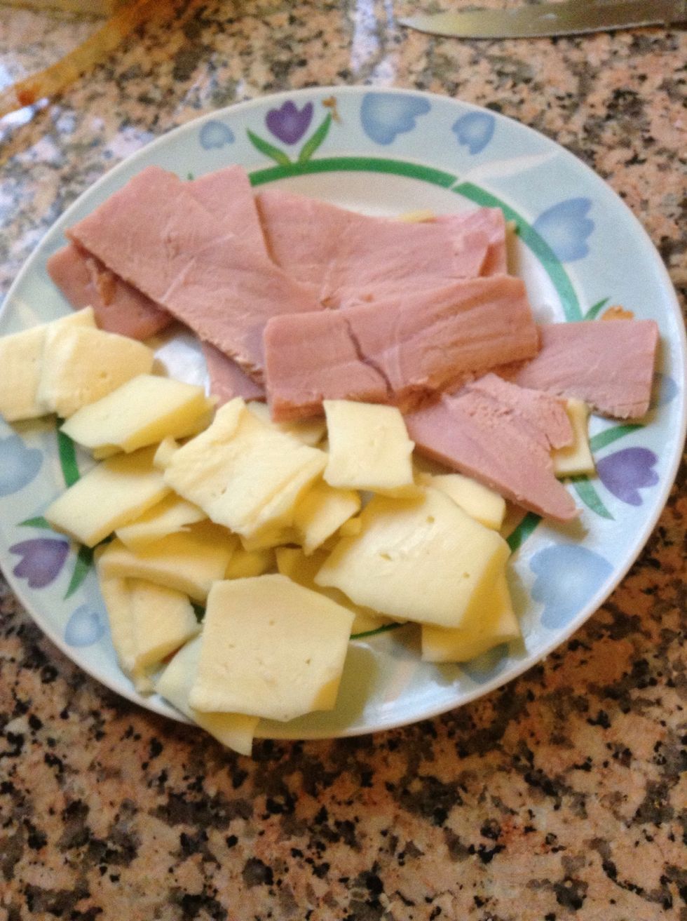 Chop up your cheese and your ham.