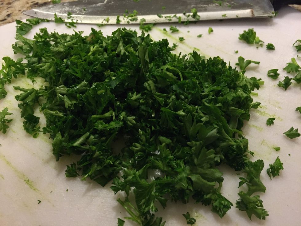 Chop up your fresh parsley and add to the pan, let this simmer in the pan for about 5-7 minutes.