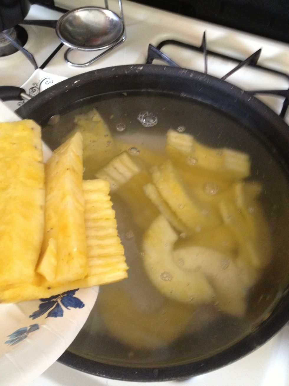 Chop up your pineapple and add it to the pot as well.