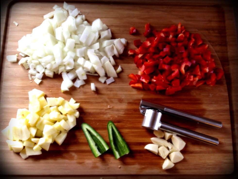 Chop veggies (onion, bell pepper, apple) I used a garlic press for the garlic. {I hadn't minced the jalepe\u00f1o yet because I omitted it. Too hot for my little boys. My husband topped his meal with it.}