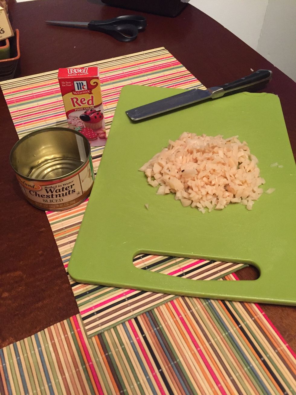 Chop water chestnuts. Add a few drops of red food coloring.