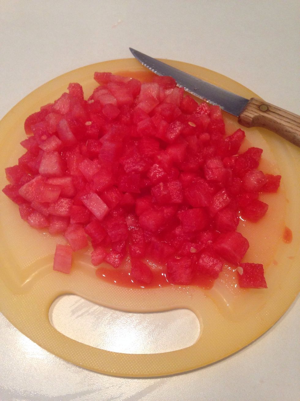 Chop watermelon into small cubes.