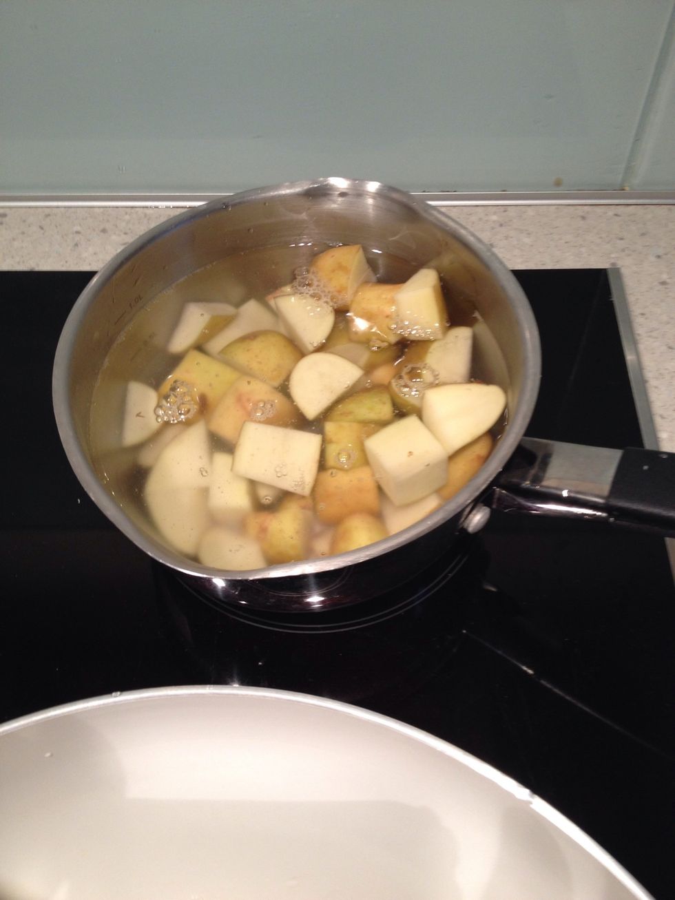 Chop yer potatoes in to one inch cubes, boil for 10 mins max
