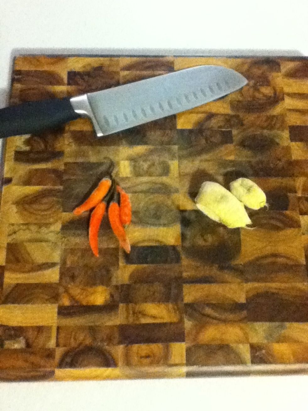 Chop your ginger and chiles. I finally figured out how to take a picture of my cutting board without casting a shadow over it. I am ready for a job in the industry.