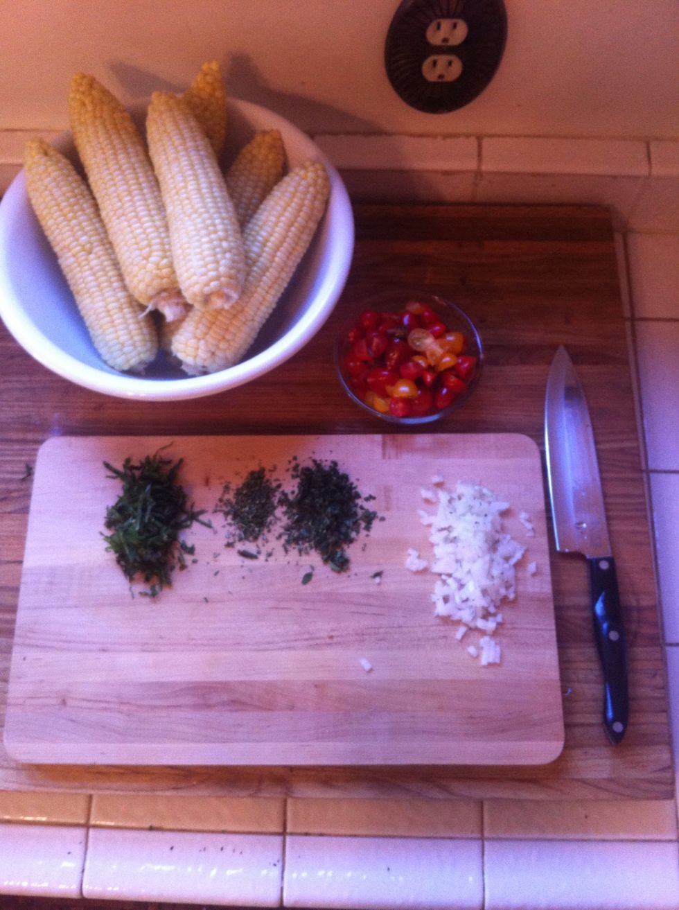 chop your herbs and onion. here I used (from left to right) fresh mint leaves, rosemary, and oregano. you can use almost any herbs you have. (italian parsley, basil, sage would all be delicious too)