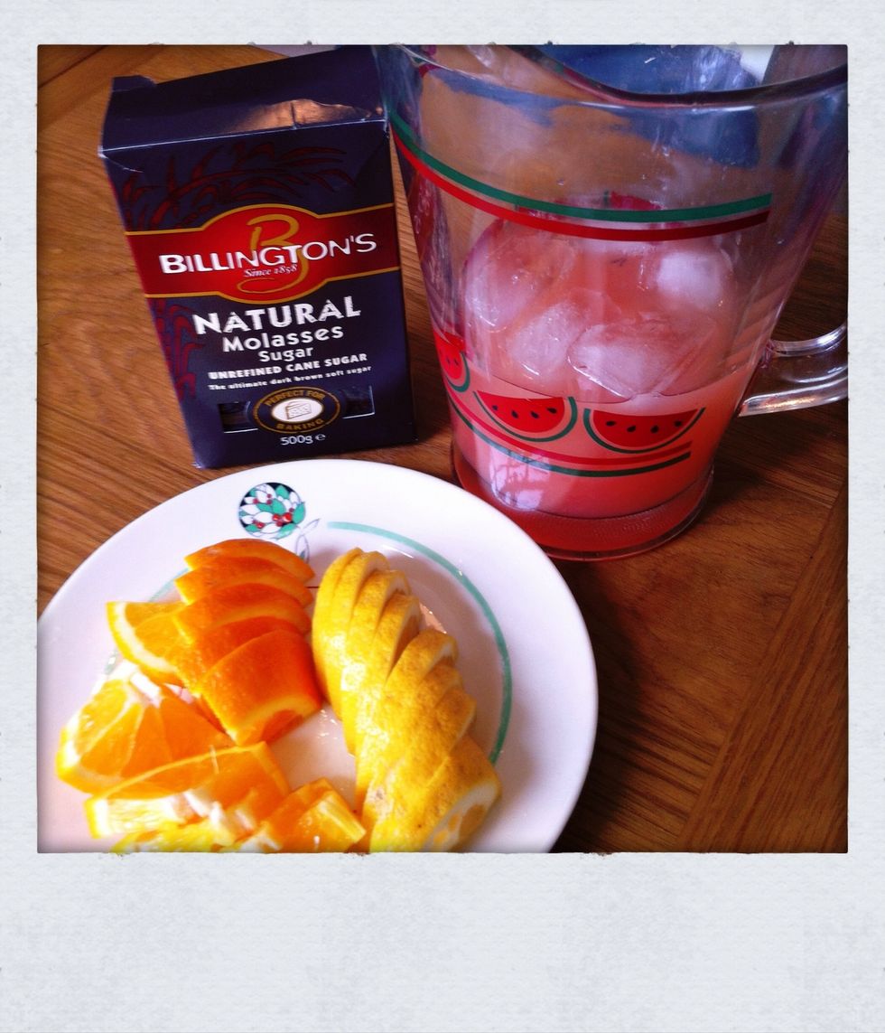 Chop your orange and lemon for garnish. Add molasses sugar to taste, we like 1-2 dessert spoons. Stir very well.