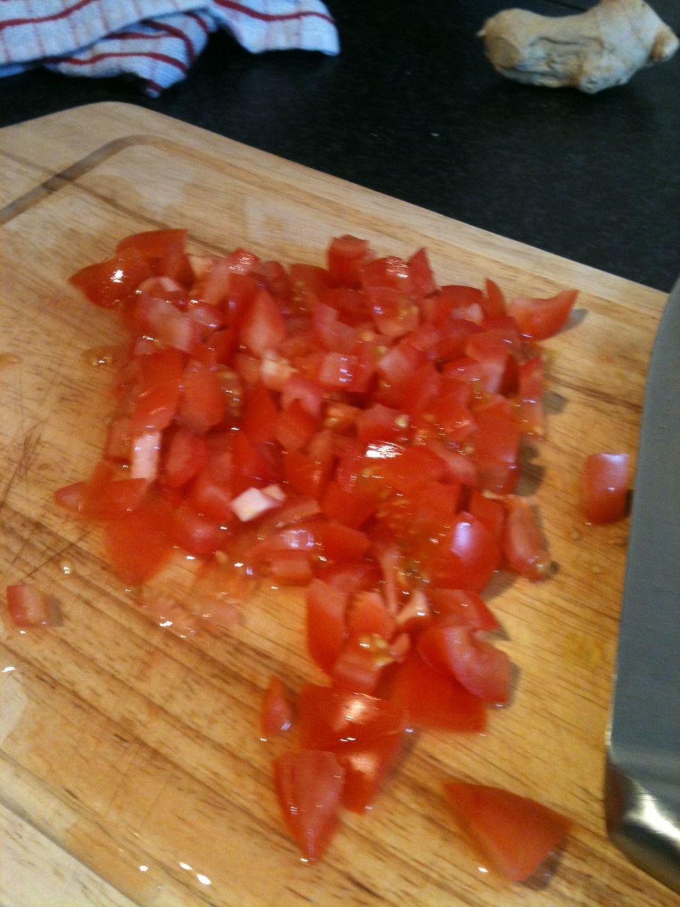 Chop your tomatoes and add them to the pan.