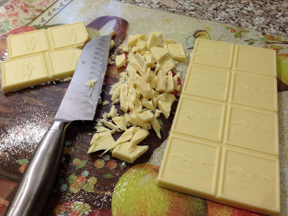 Chop your white chocolate and melt it in the microwave. It should take about 1-2 minutes, check it every 15 seconds you don't want it to burn! I made this bark for Halloween so I used food coloring!