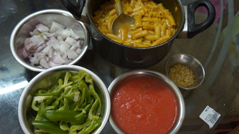 Chopped Capsicum tomato pur\u00e9e lime extract half boiled pasta chopped onions