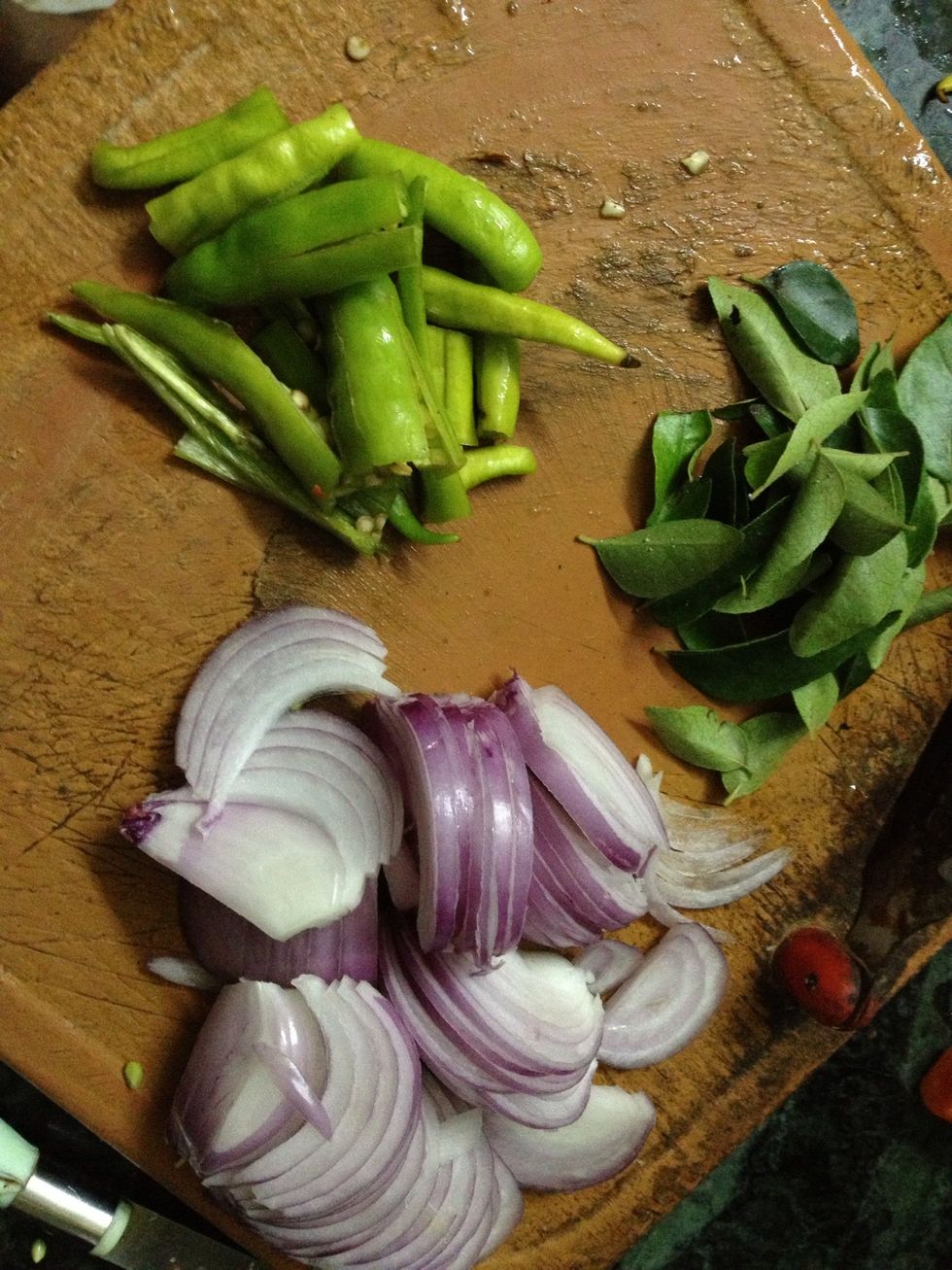 Chopped onions and green chillies, curry leaves..
