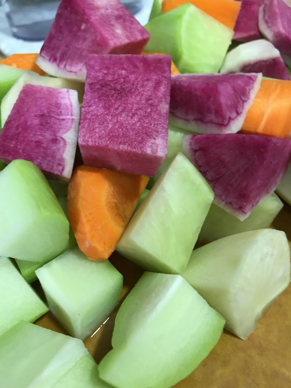 Chops all the carrots & turnips into small cubes