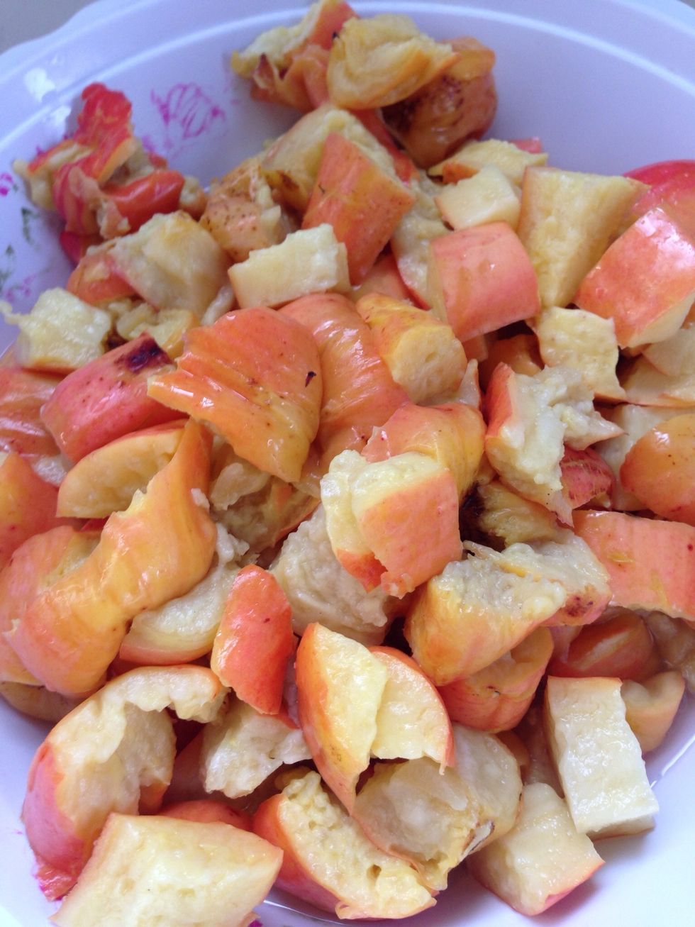 Chops up the fruit into cubes. This fruit will stain any clothing so be careful not to get it on you.