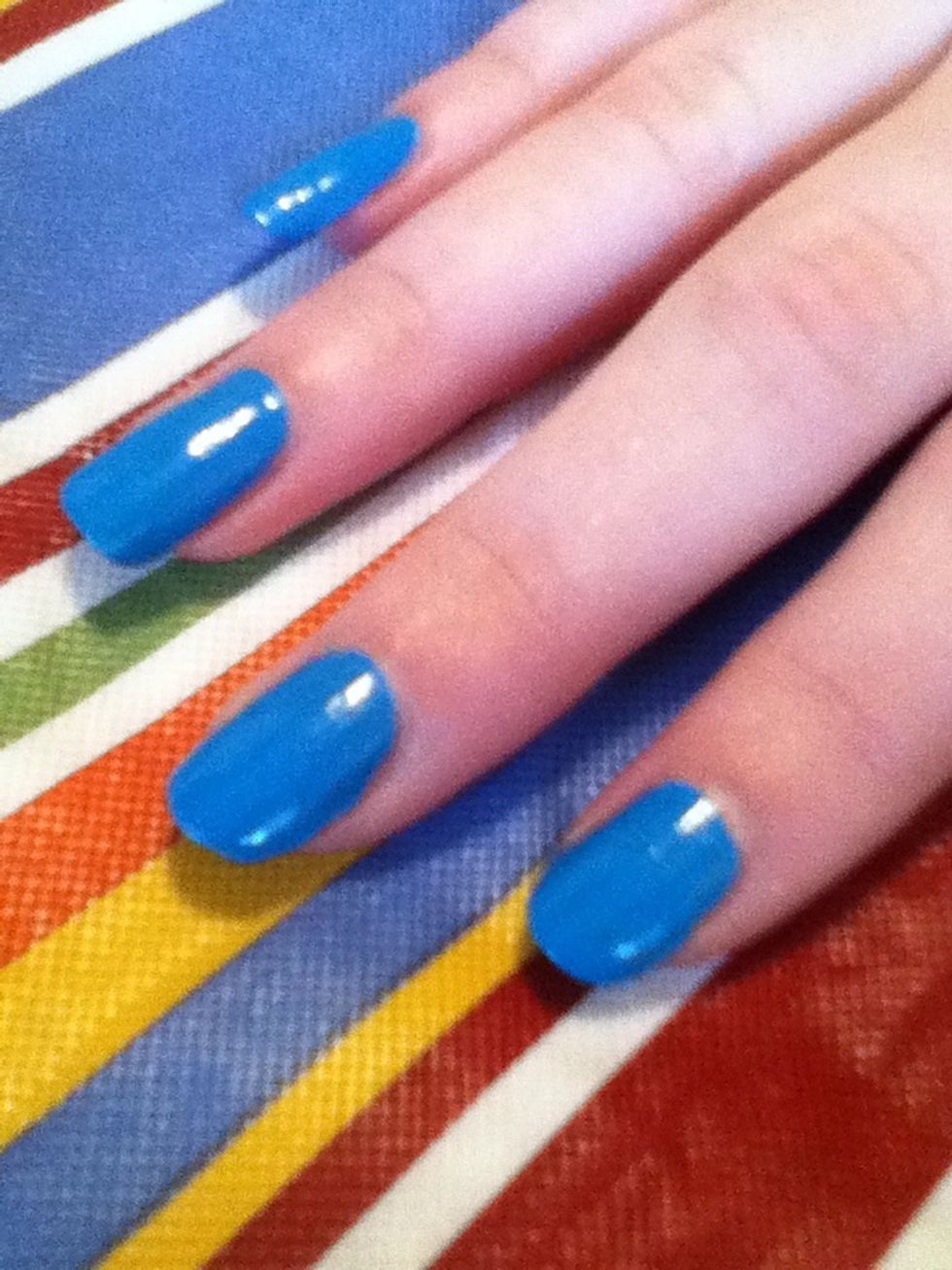 Chose a color that will match an accessory that you have on so your nails will compliment that accessory. I chose blue for an example.