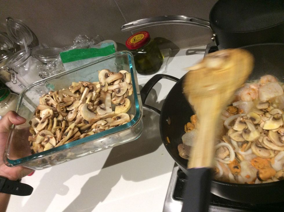 Chuck all of the mushrooms back in the pot and mix for another minute.
