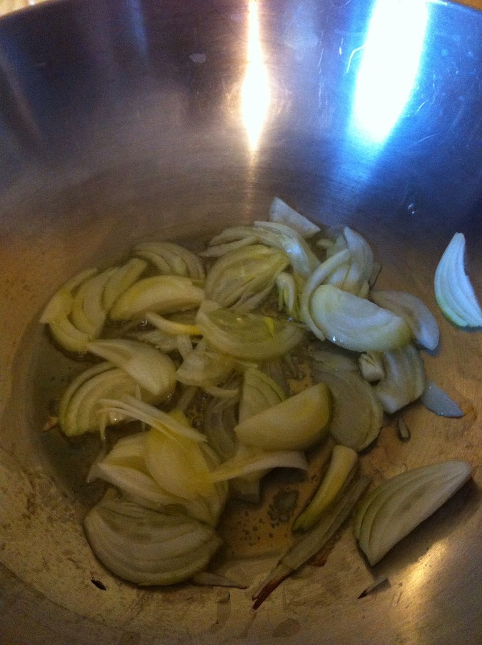 Chuck onions in with garlic with olive oil. Be generous with the olive oil. It sweetens the onions.