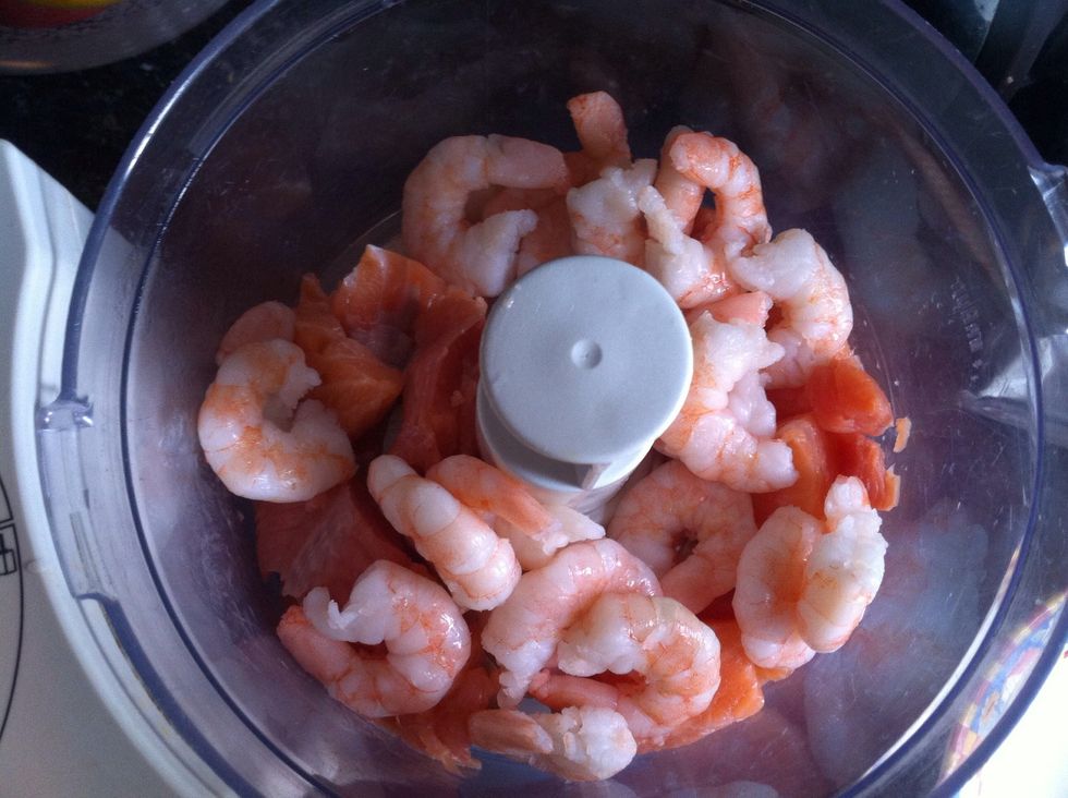 Chuck the salmon and prawns into the blender. (King prawns add better texture).