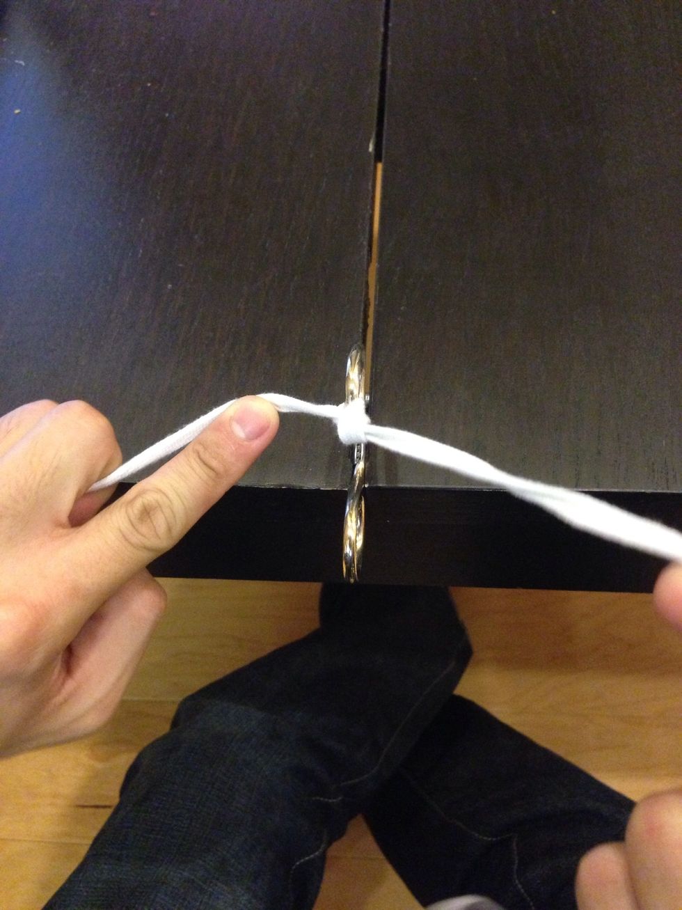 Cinch the knot down while maintaining tension in opposite directions, 180 degrees from each other, to minimize tension on the tissue.