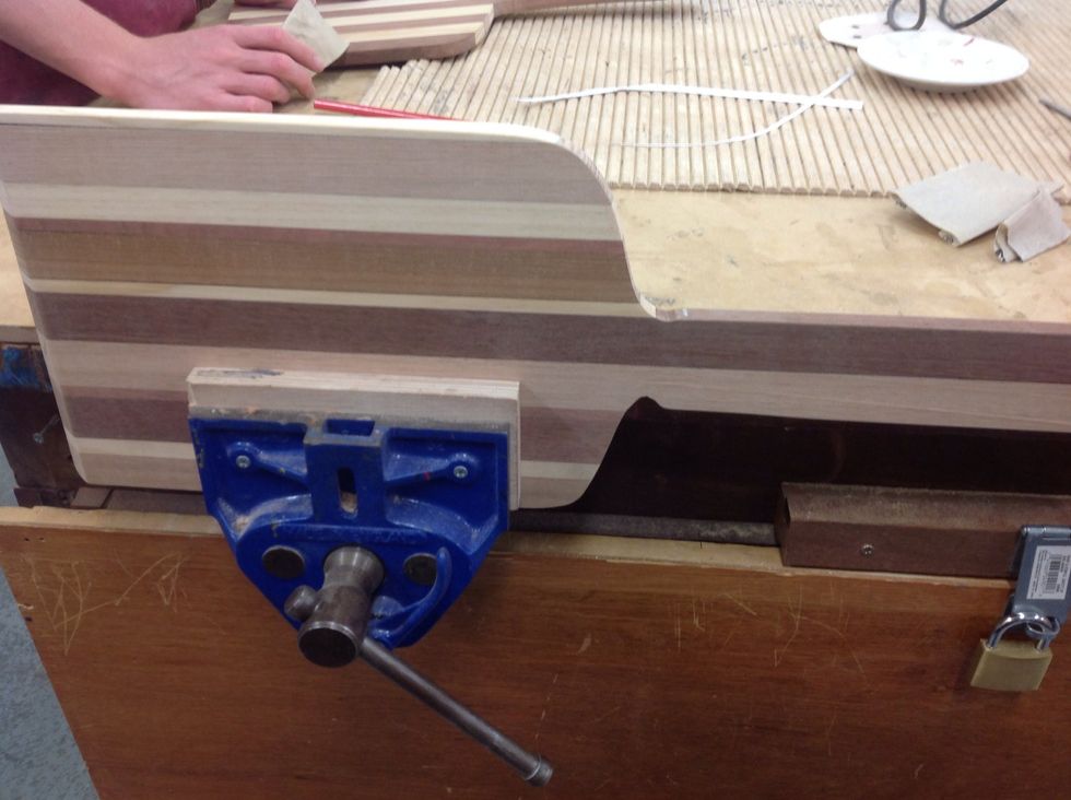 Clamp so you can sand it without it moving everywhere.